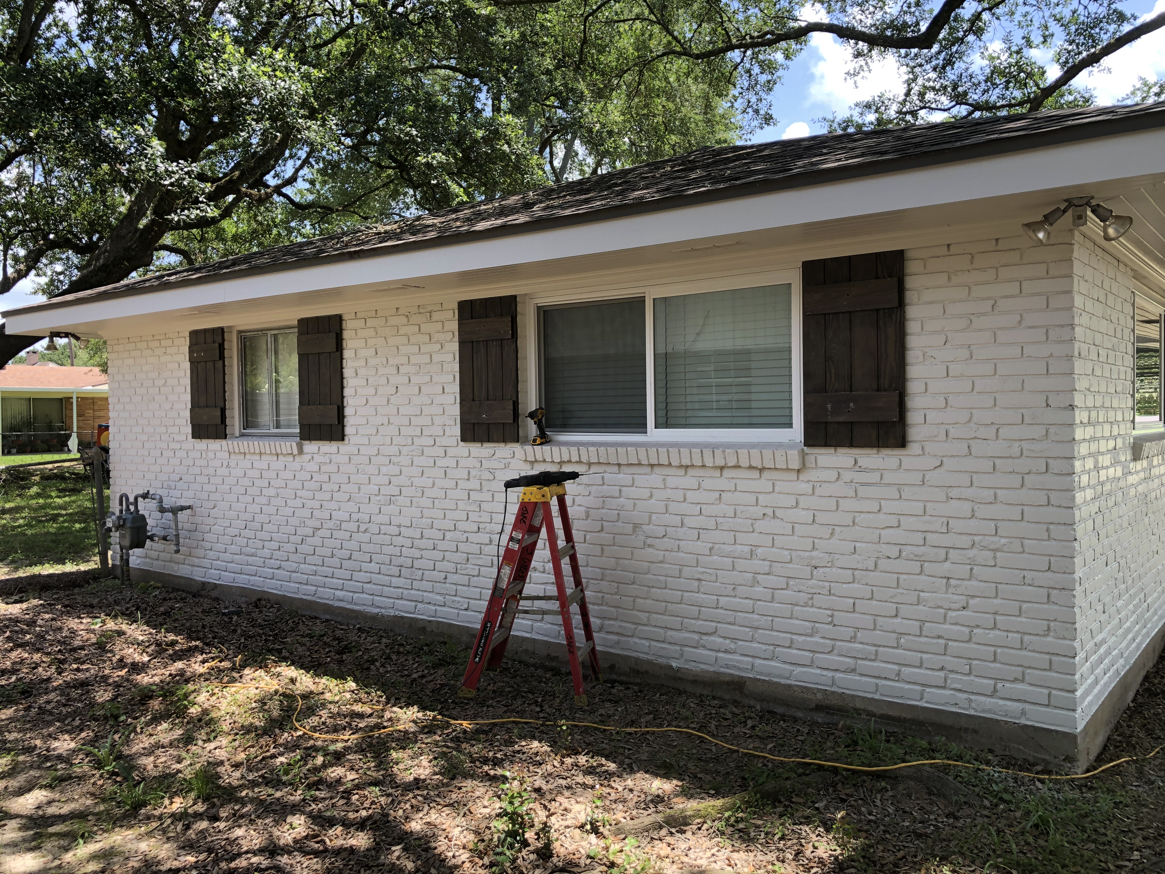 Exterior painting - white brick and shutters